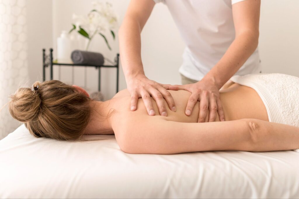 Woman having back massage therapy