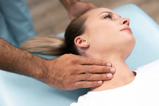 Doctor's hand on patient's neck