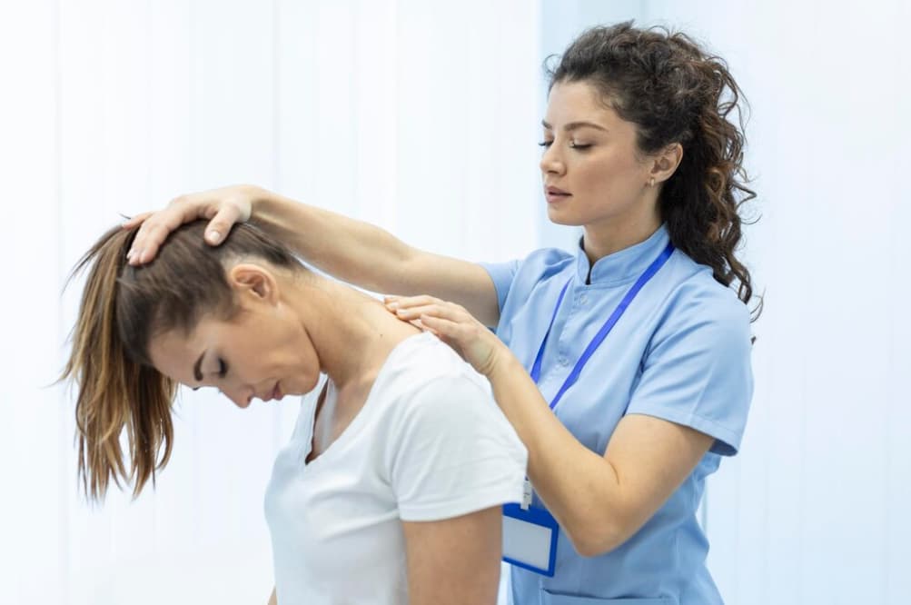 A chiropractor performs a spinal adjustment on a patient